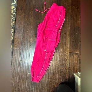 IVY Park (Beyoncé brand) by adidas pink sweatpants.